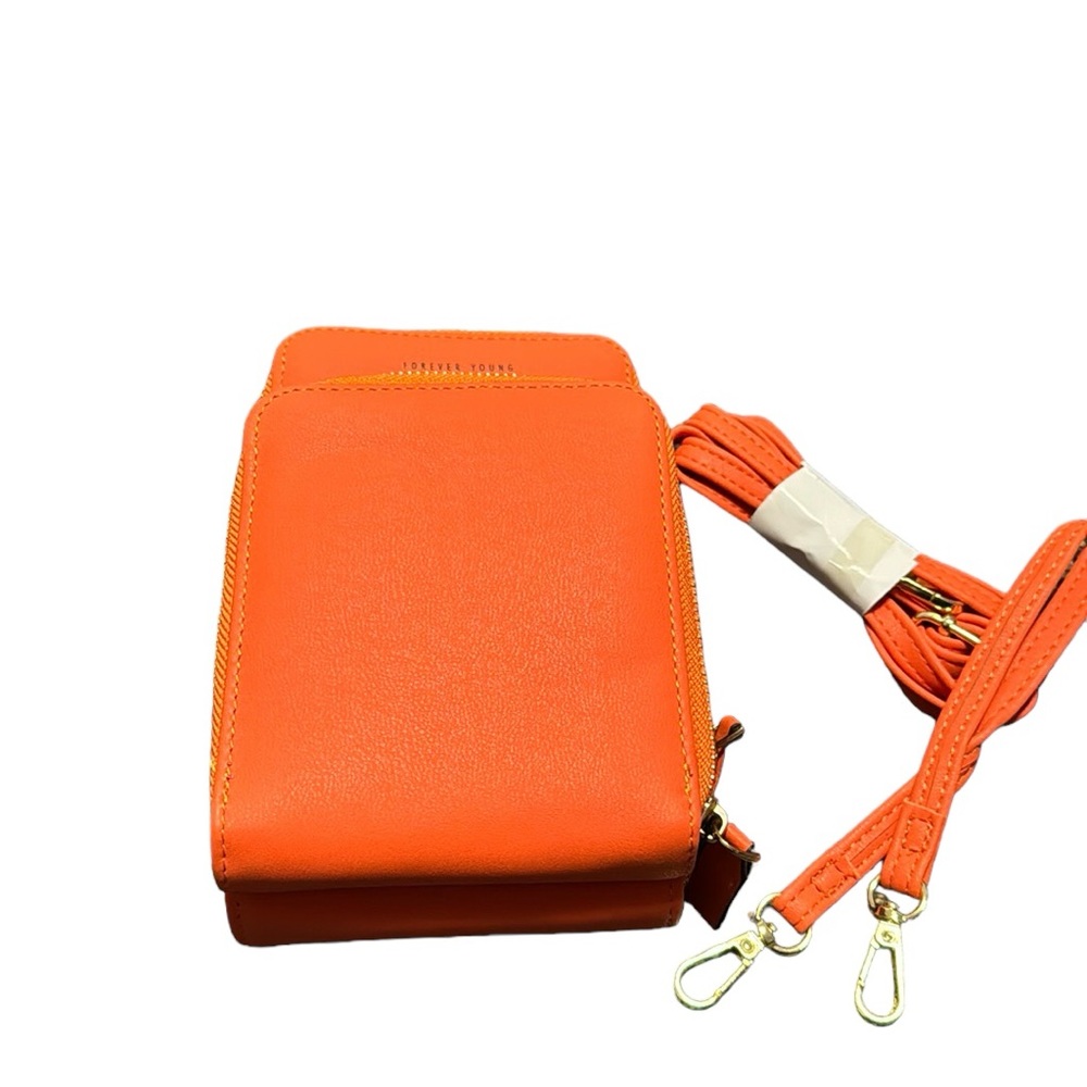 Forever Young Multi-compartment convertible crossbody bag in orange. NWT